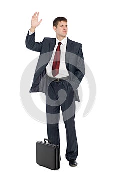 Young businessman with a welcoming gesture