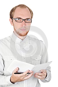 Young businessman in white shirt with notebook