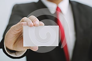 Young businessman who takes out blank business card