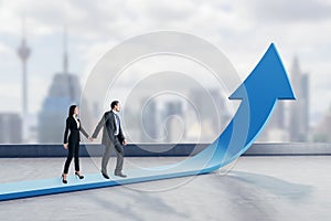 Young businessman and woman walking on abstract upward blue arrow on blurry city background. Growth, career and growing finance