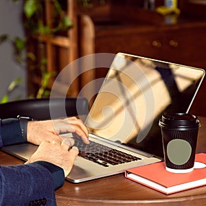Young businessman working at coffee shop