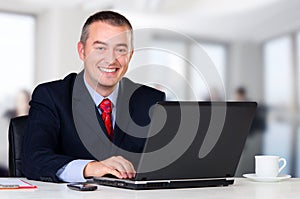 Young businessman working in his office