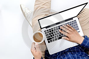 Young businessman working at laptop computer with hot coffee in hand , Business Research, business man hand working on laptop