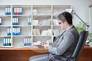 The young businessman working in the office