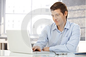 Young businessman working in office