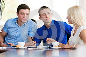 Young businessmen sitting at a desk in the office, in the negoti