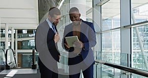 Young businessmen using tablet in a modern office