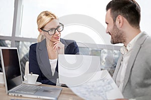 Young businesspeople having a business meeting at coffee shop