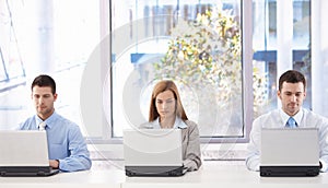 Young businesspeople sitting in meeting room