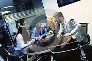 Young businesspeople working on computer in office