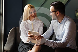 Young businesspeople working on computer in office