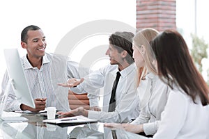 Young businesspeople working on computer in office