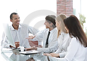 Young businesspeople working on computer in office