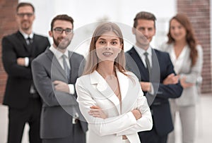 Young businesswoman on the background of her business team