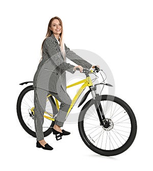 Young businesswoman with bicycle on background