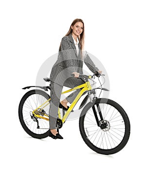 Young businesswoman with bicycle on white