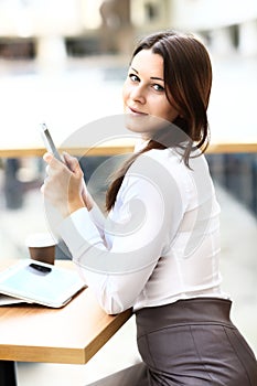 Young businesswoman on a coffee break