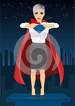 Young businesswoman dressed like super hero and tearing her shirt off watching over night city