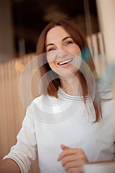 Young businesswoman in eyeglasses planning and writing down the daily schedule with in agenda