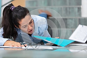 young businesswoman falling on stairs inside office building