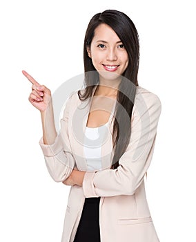 Young businesswoman with finger showing up