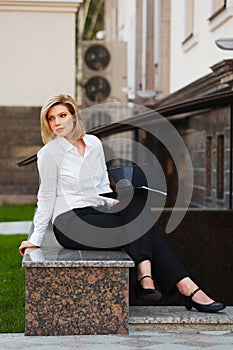 Young businesswoman with a folder