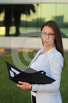 Young Businesswoman with Folder - Stock Image
