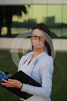 Young Businesswoman with Folio - Stock Image