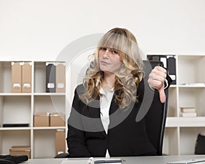 Young businesswoman giving a thumbs down