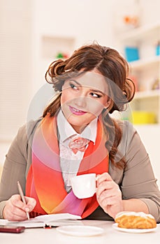 Young businesswoman having breakfast