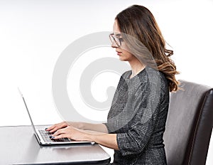 Young businesswoman at her laptop