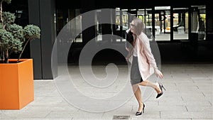 Young Businesswoman on High Heels Stumbled. Hard-Working Women Is Going To a Work Centre. Professional Concept.