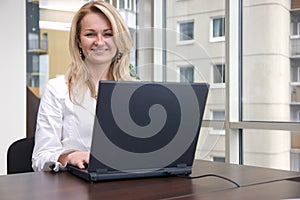 Young businesswoman with laptop