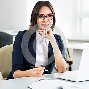 Young businesswoman with laptop