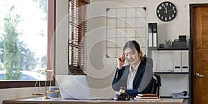 A young businesswoman lawyer is looking stressed as she works at her computer. consultant lawyer, justice and law