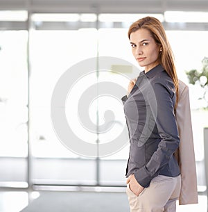 Young businesswoman leaving office