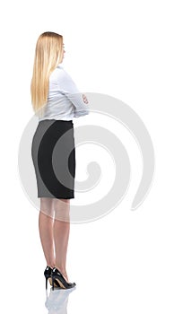 Young businesswoman looking at something. Back view