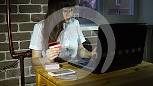 A young businesswoman makes purchases in an online store.