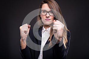 Young businesswoman making a defensive fight pose