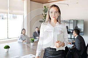 Young businesswoman in office conference room