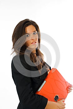 Young businesswoman with orange file binder