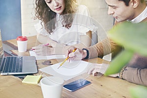 Young businesswoman with partners people gathered together, discussing creative idea in office. Using modern laptop, having coffee