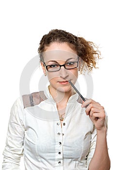 Young businesswoman with pencil against white