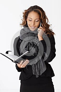 Young businesswoman on phone smiling