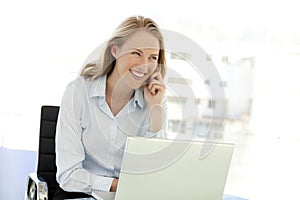 Young Businesswoman on the phone at workplace