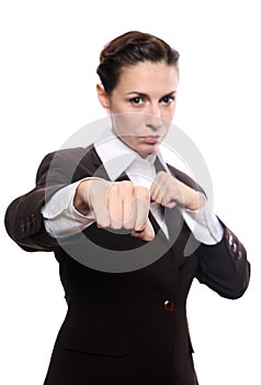 Young businesswoman punching
