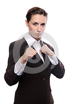 Young businesswoman punching