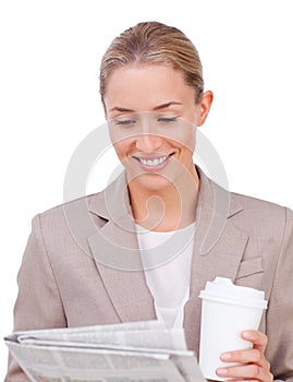 Young businesswoman reading a newspaper