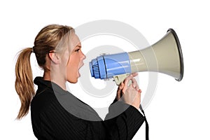 Young businesswoman screaming with a megaphone photo
