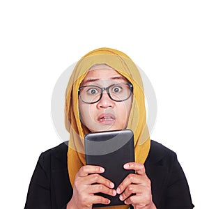 Young Businesswoman Shocked Holding Tablet